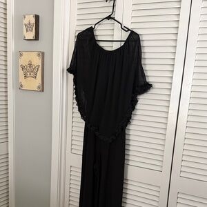 Black jumpsuit with sheer ruffle overlay